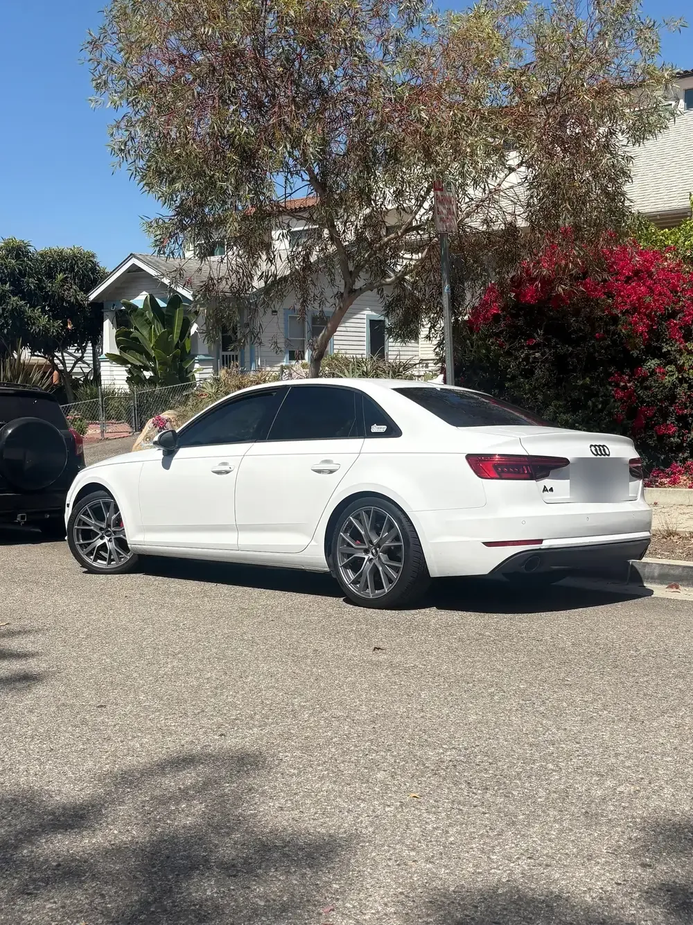 White Audi sedan, washed and dried