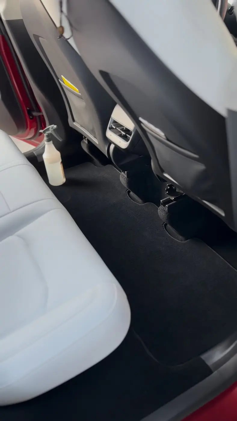 White leather seats and carpet after an interior detail